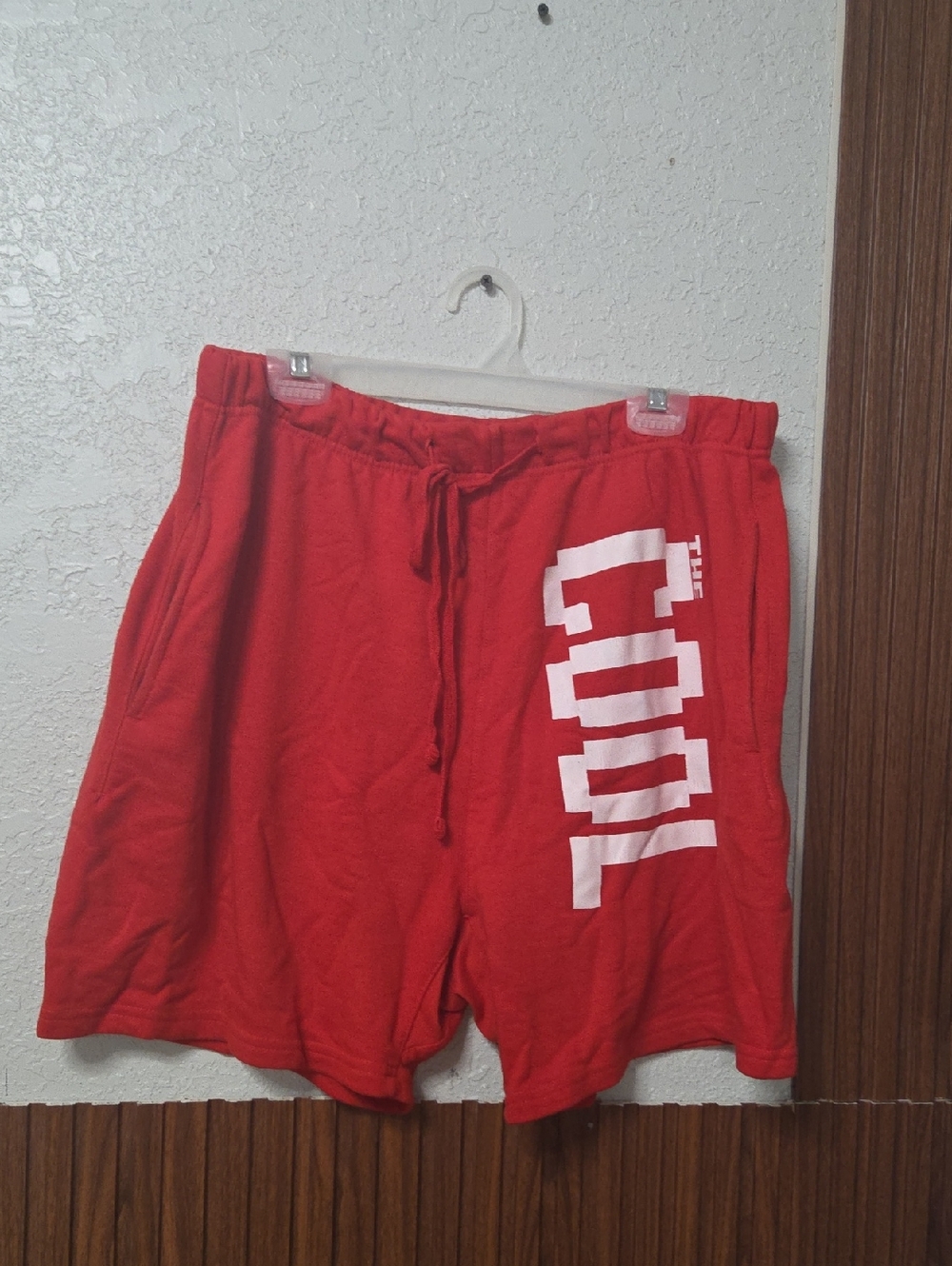 Red Athletic Men's Shorts with White Vertical 'COOL' Graphic
